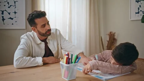 Father teaching bored child doing homework room closeup. Mother bringing water Video stock 278185784