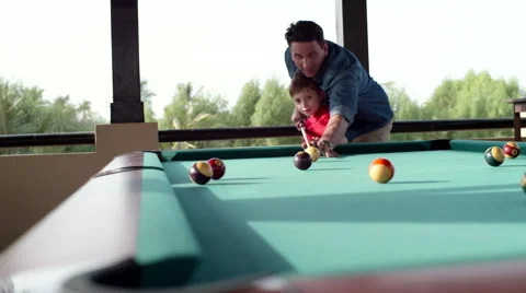 Father teaching his son billiard. Stock Footage 64107546