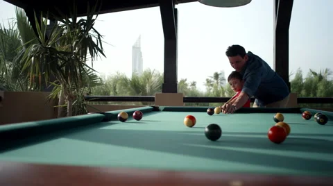 Father teaching his son billiard. Stock Footage 64107600