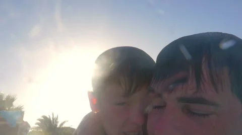 Father teaching son to dive in the pool Stock Footage 52496292