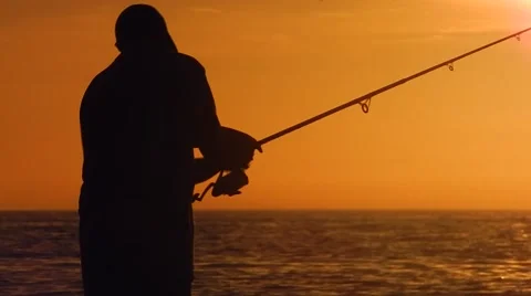 Father teaching son how to fish Vídeos de archivo 45519288