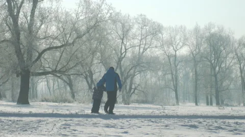 Father teaching Son to ski 4k UHD (3840x2160) Stock Footage 61031161