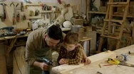 Father Teaching Son To Use Drill Stock Footage