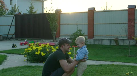 Father Throwing Up His Son Stock Footage 56254631