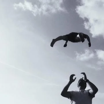 Father throwing son into air Stock Photos