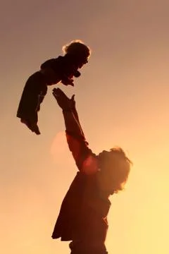 Father throwing son Stock Photos