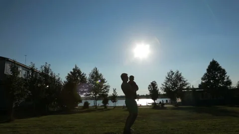 Father throws his son Stock Footage 92431532