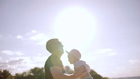 The father throws the little son up. Stock Footage 77527689