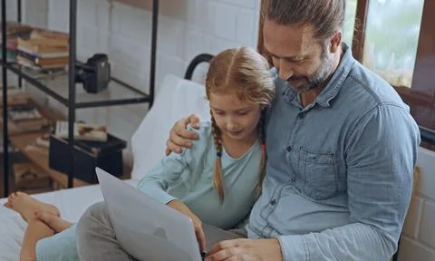 Father using laptop computer with young daughter. Happy family, Father feel.. Stock Photos
