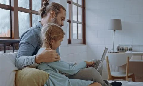 Father using laptop computer with young daughter. Happy family, Father feel.. Stock Photos