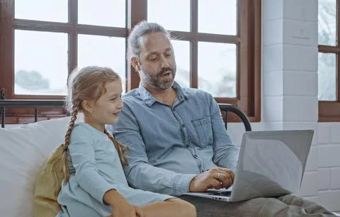 Father using laptop computer with young daughter. Happy family, Father feel.. Stock Photos