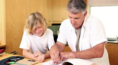 Father using a protractor with his son Video stock 10811796
