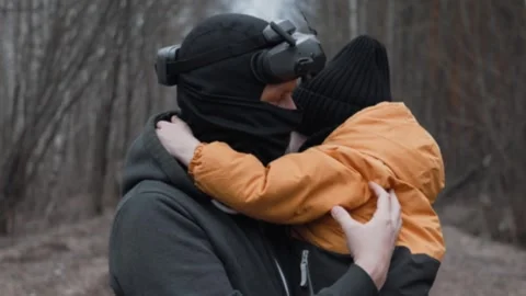Father Using VR Headset While Holding Son in Arms in Enchanted Forest - Virtual  Stock Footage 305322409