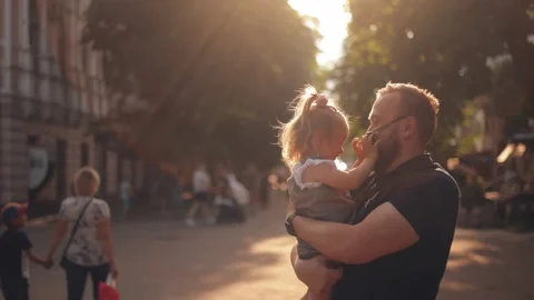 A father walks with his daughter in the park Stock Footage 244245953