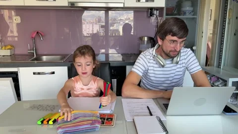 Father working from home while daughter playing Stock Footage 309301915