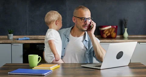 Father working with laptop Stock Footage 221361035