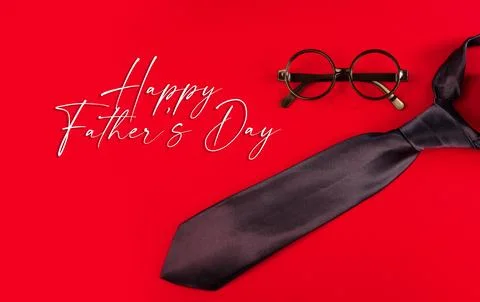 Fathers Day concept featuring a black necktie and round eyeglasses Stock Photos