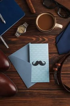 Father's Day concept flat lay with greeting card and accessories Stock Photos