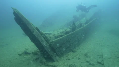 Fathom Five Marine Park, James C King shipwreck, scuba diver near the bow Stock Footage 311948965