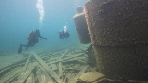 Fathom Five National Park - W.L. Wetmore Shipwreck, divers exploring the boiler Stock Footage 253429522