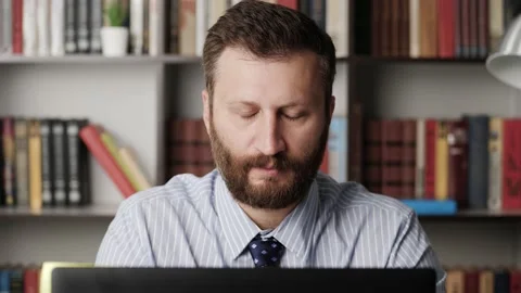 Fatigue. Close-up of man at workplace working at computer and experiencing Stock Footage 132704319