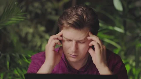 Fatigue at the computer. A man working at home in the kitchen Stock Footage 150159713