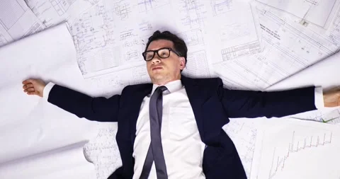 Fatigue. Project work. View from above. A young adult man in a business suit and Stock Footage 276912231