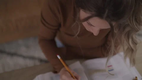 Fatigued College Student Solving Math Problems While Sitting at a Desk Stock Footage 208739213