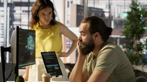 Fatigued software engineer caught asleep at desk by manager Stock Footage 318234651