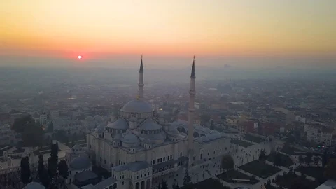Fatih mosque flying around behind sundown Stock Footage 102586916