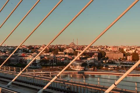 Fatih Mosque Framed by Halic Bridge Cables at Sunrise Stock Photos