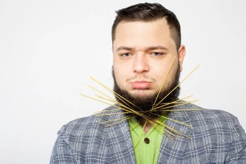 Fatso with pasta in beard Stock Photos