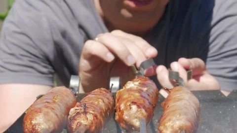 Fatty appetizing sausages cook on fire. Fat drips into the fire. A lot of smoke Stock Footage 78548638