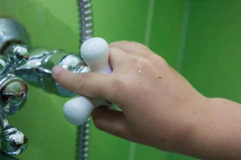 Faucet and hand Stock Photos