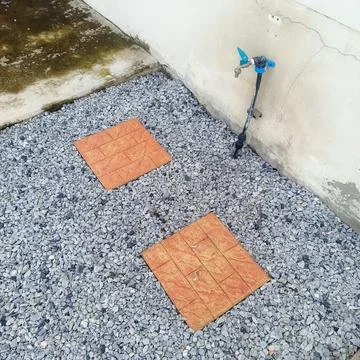 Faucet and stone path Stock Photos
