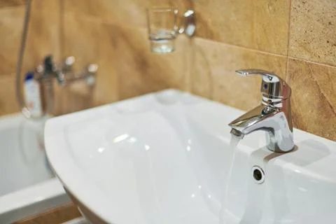 Faucet in bathroom interior. Stock Photos