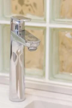 Faucet in bathroom Stock Photos