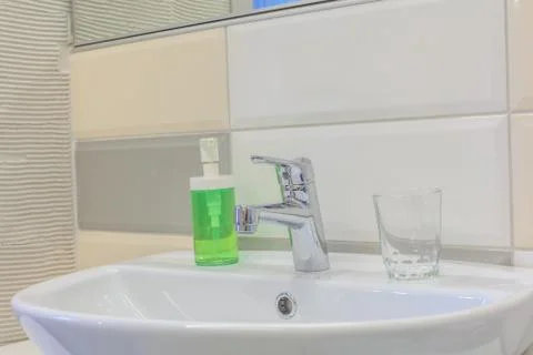 Faucet in bathroom Stock Photos