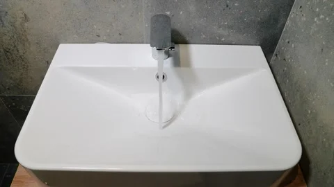 The faucet in the bathroom with running water. Stock Footage 247794784