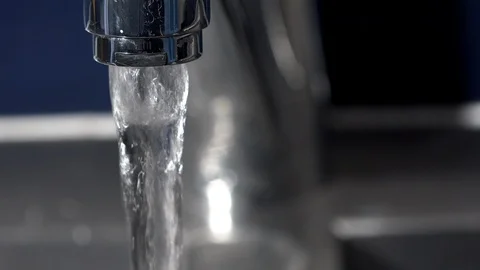 Faucet being turned on in Kitchen UK 4K Video stock 125074186