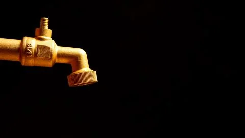 Faucet on a black background Stock Photos