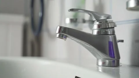 Faucet dripping for a long time, close up Stock Footage 139051307