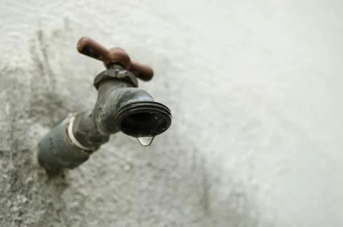 Faucet dripping water, concept of water shortage, lack of water, close up to  Stock Photos