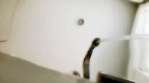 Faucet filling the bathtub Stock Footage