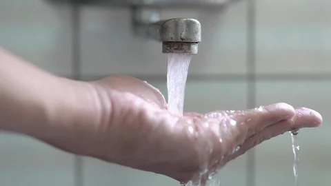 Faucet ,hand with water, close up. Stock Footage 95788911