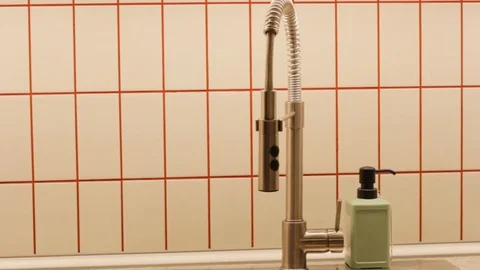 Faucet in the kitchen . workspace for cooking . sink for hands and utensils 스톡 동영상 121728822
