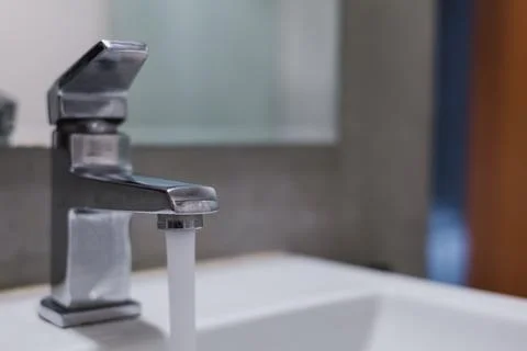 The faucet left in the hotel Stock Photos