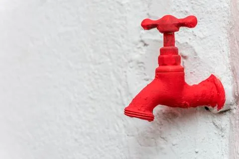 Faucet painted red Stock-Fotos