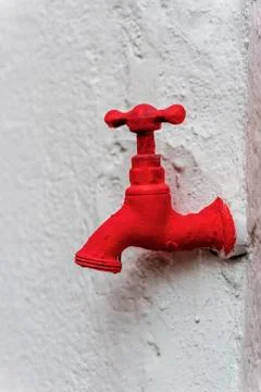 Faucet painted red Stock Photos