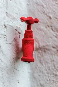 Faucet painted red Stock Photos